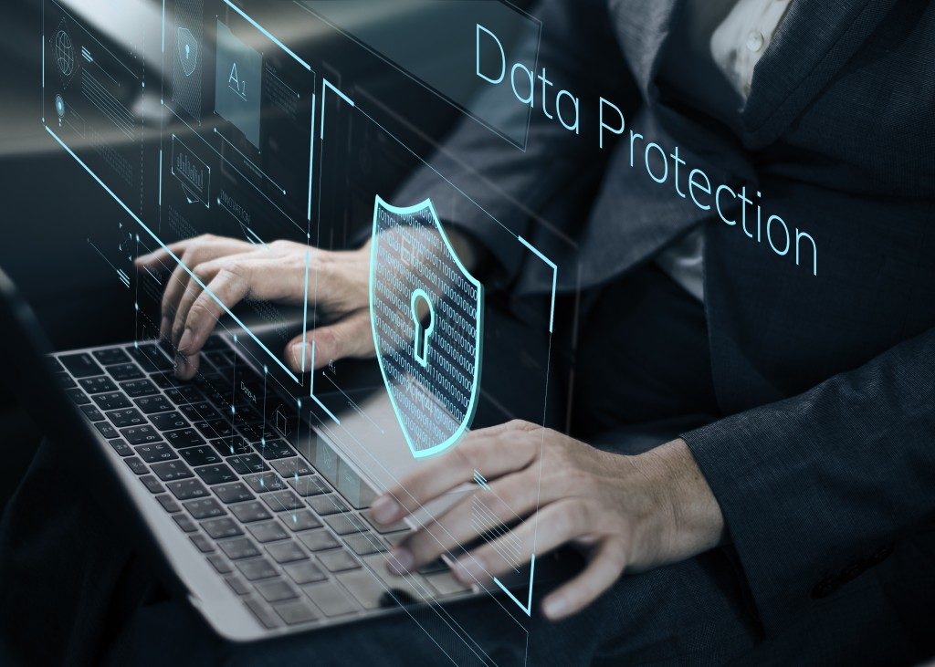 data protection digital image above a person using a laptop