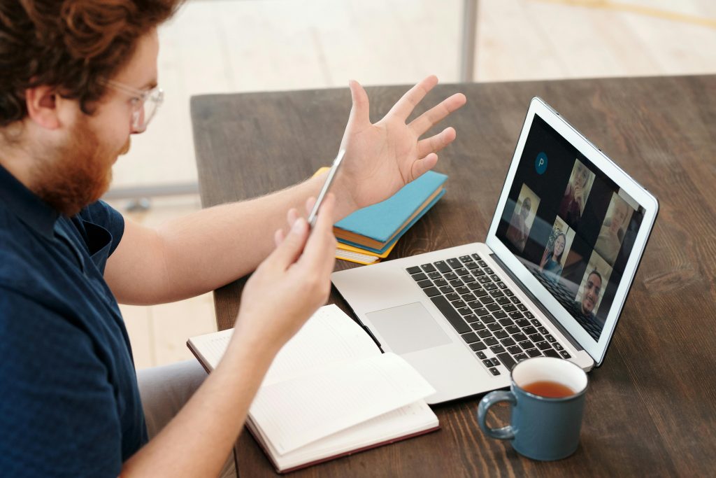 man participating in a virtual meeting